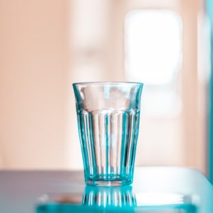 clear drinking glass on white table